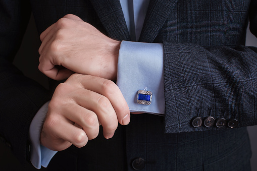 Hand Men Wears Cufflinks Close Up